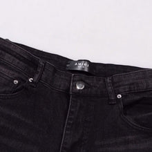 Amiri Jeans splashes ink and washes old ripped slim jeans